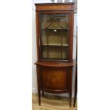 An Edwardian inlaid mahogany display cabinet, fitted single glazed door over cupboard, W 66.5cm