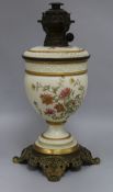 A Royal Worcester floral painted blush ground oil lamp height 42cm