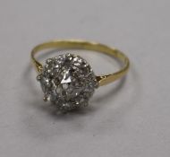 A mid 20th century 18ct gold and diamond cluster ring, size O.