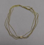 A 9ct gold multi-strand necklace with cultured pearl cluster centre, approx. 38cm.