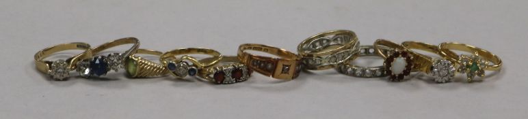 Six assorted 9ct gold and gem set rings, two 18ct rings, one 15ct ring and two yellow metal rings.