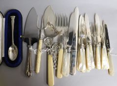 Six pairs of late Victorian mother of pearl handled silver fruit eaters, a pair of fish servers,