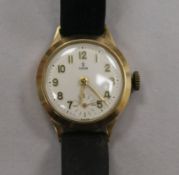 A lady's Rolex Tudor 9ct gold-cased wristwatch, on leather strap, in red heart-shaped box.