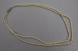 A twin strand graduated cultured pearl necklace with 9ct white gold clasp, 54cm.