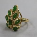 A modern 14ct gold and cabochon jade set cocktail ring, size N.