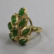 A modern 14ct gold and cabochon jade set cocktail ring, size N.