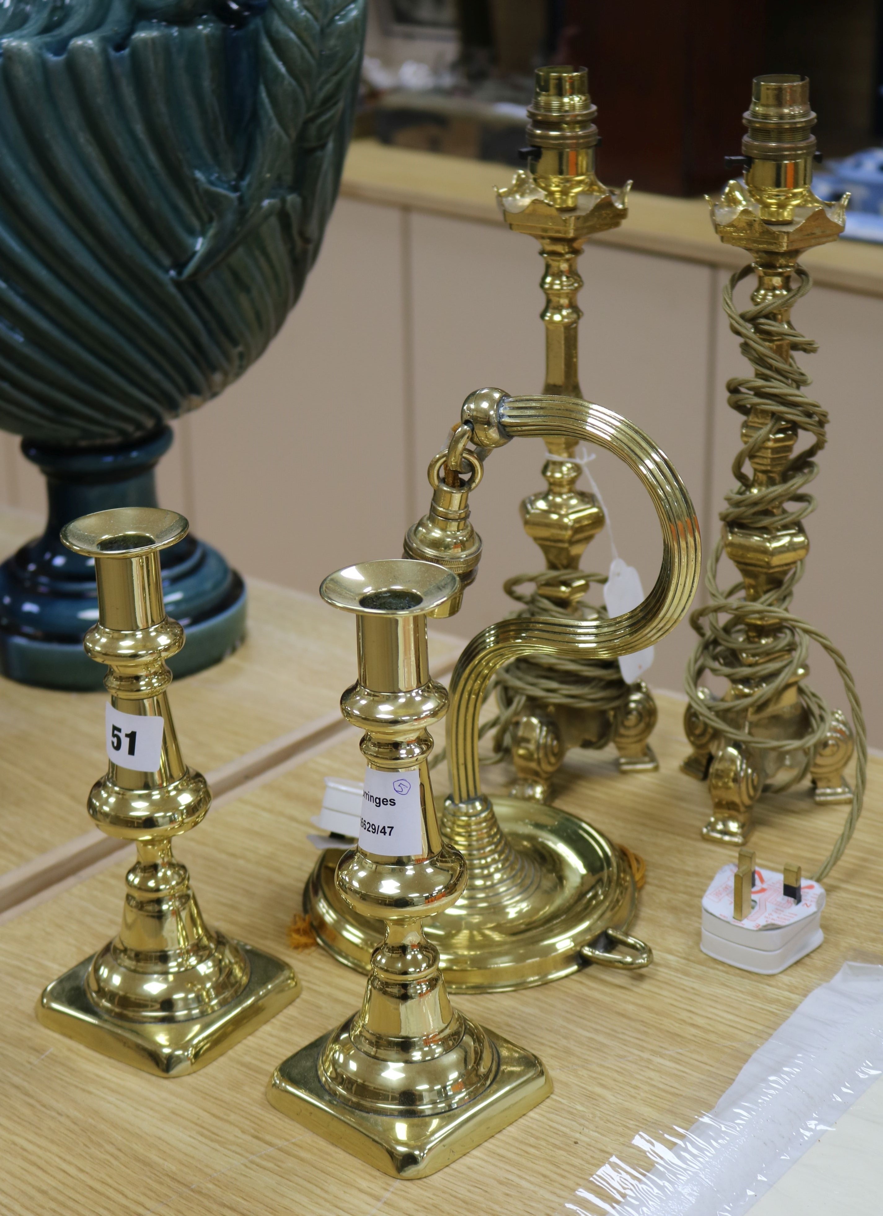 A pair of brass table lamps, another and a pair of candlesticks lamps height 35cm