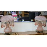 A pair of pink glass table lamps