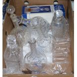 A collection of cut glass and pressed glass decanters