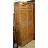 A tambour shutter filing cabinet W.80cm