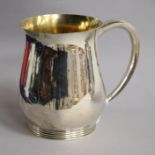 A modern planished silver mug, Brian Leslie Fuller, London, 1977, 13cm, 13 oz.