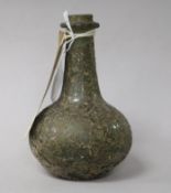 A Roman green glass bottle, of globular form with long narrow neck and iridescent overlay (rim a.