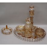 A Baccarat five piece clear and amber glass dressing table set