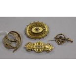 Four assorted 9ct gold brooches including one late Victorian gem set.