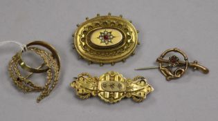 Four assorted 9ct gold brooches including one late Victorian gem set.