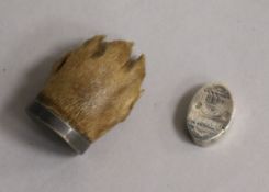 A George III silver vinaigrette and a paw brooch.