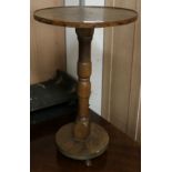 A circular side table on column support W.39cm