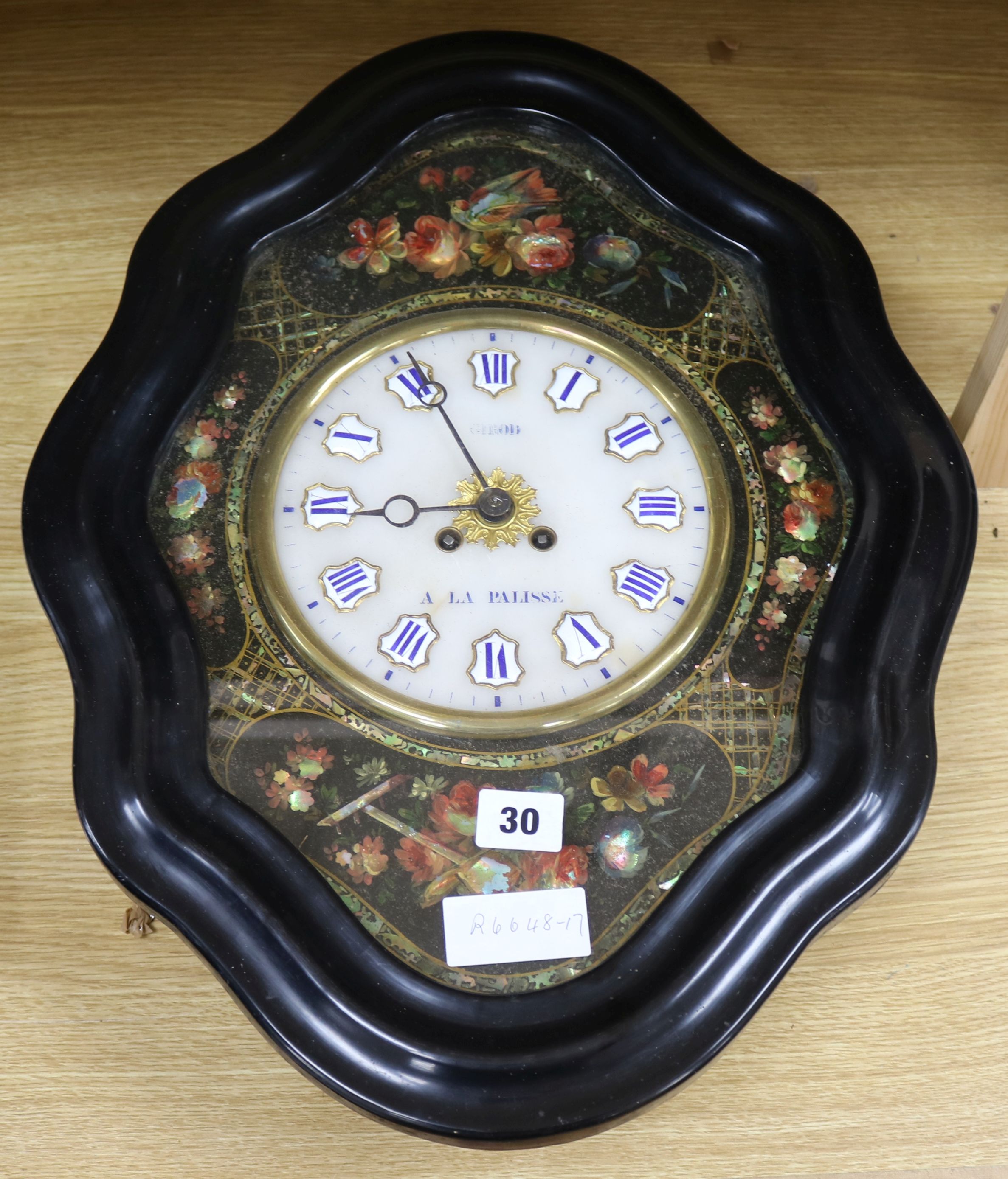 A mother of pearl inlaid wall clock by Griod A La Pallisse width 38cm height 50cm