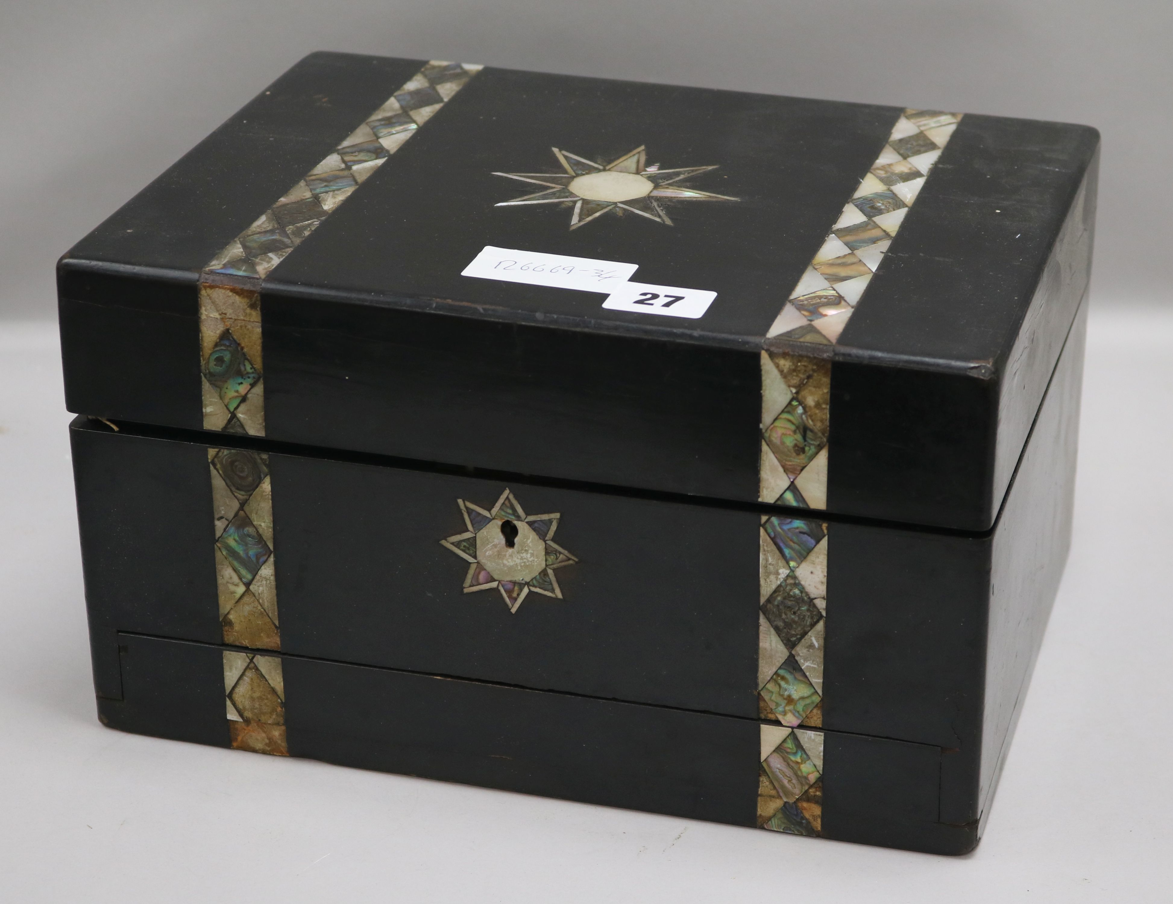 A Victorian ebonised mother of pearl and abalone inlaid travelling toilet box, with plated mounted