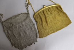 A gold plated purse and a white metal mesh purse.