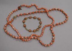 Two single strand coral bead necklaces with 14ct gold clasps and a 9ct gold and coral bracelet.