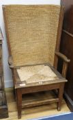 An Orkney Islands oak chair, with woven back W.63cm