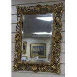 A hand carved florentine frame with mirror W.53cm