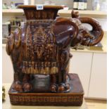 A Chinese brown glazed elephant garden seat height 56cm width 54cm