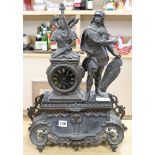 A figural mantel clock height 54cm