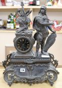 A figural mantel clock height 54cm