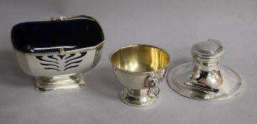 A late 1960's silver sugar basket with liner, a silver capstan inkwell and a small silver bowl
