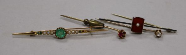 An early 20th century yellow metal, seed pearl and emerald bar brooch, a 15ct? gold bar brooch and