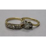 An 18ct gold and graduated five stone diamond ring and an 18ct gold and two (ex 3) stone diamond