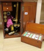 A cased microscope and slides box width 22cm height 42cm