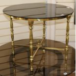 A brass glass topped coffee table W.69cm