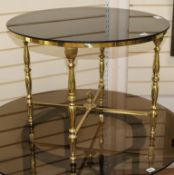 A brass glass topped coffee table W.69cm