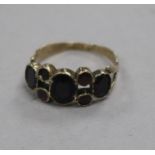 A George III yellow metal and foil backed gem set ring, with central doublet stone, size M.