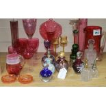 A quantity of coloured glass and scent bottles