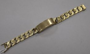 A heavy 1970's textured 9ct gold identity bracelet, 20.2cm.