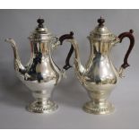 A pair of 1960's silver coffee pots by William Comyns & Sons Ltd, London, 1968, 28.4cm, gross 60.5