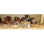 A collection of Doulton and other stoneware jugs and vessels