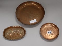 Two Newlyn copper fish dishes and a swan dish