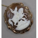 An Edwardian 9ct gold mounted oval cameo brooch, carved with St. George & the Dragon, 49mm.