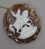 An Edwardian 9ct gold mounted oval cameo brooch, carved with St. George & the Dragon, 49mm.