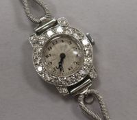 A lady's diamond-set platinum cocktail watch on 18ct white gold bracelet.