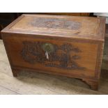 A carved camphorwood chest W.105cm