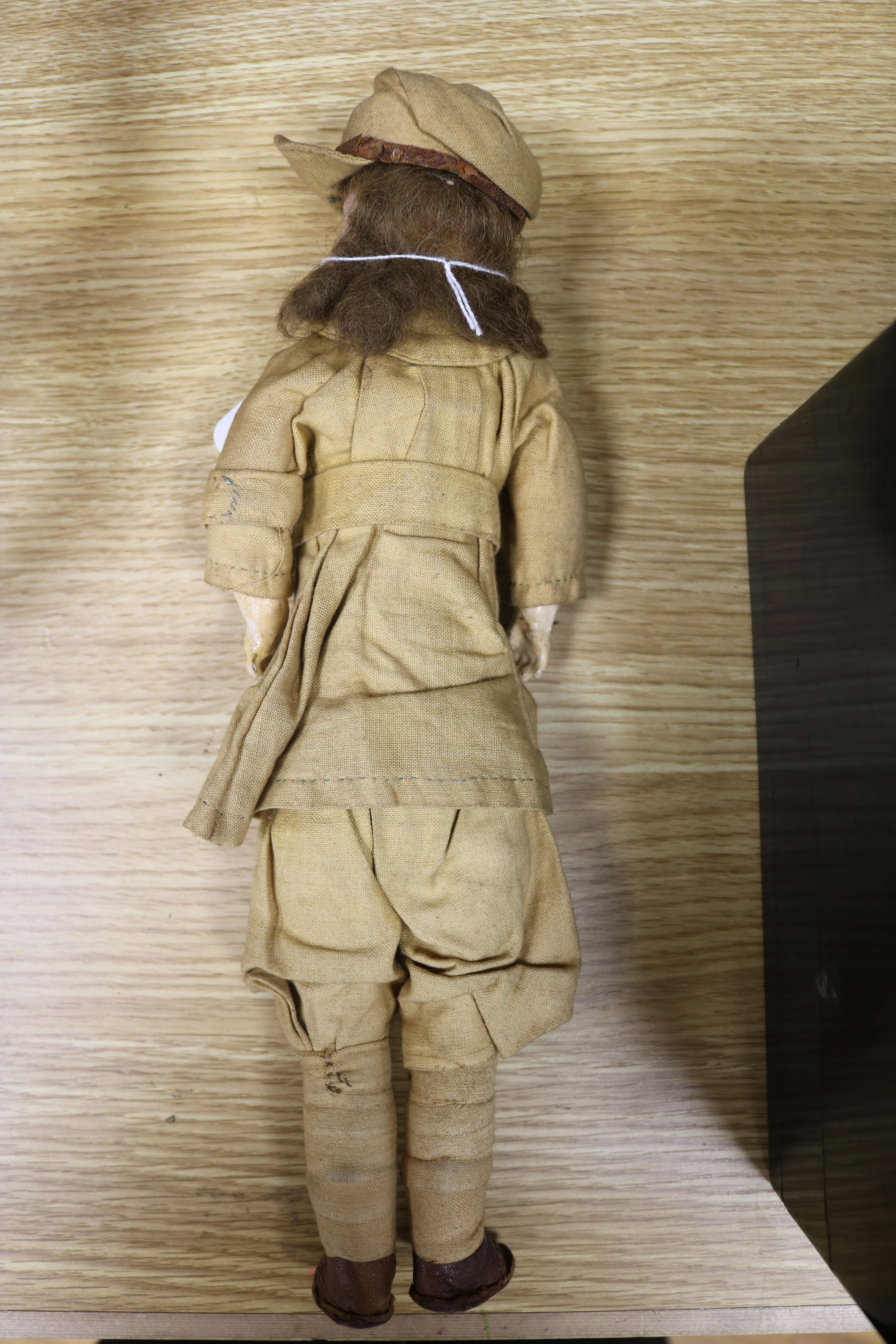 A French bisque head doll dressed in WWI army uniform length 33cm - Bild 2 aus 5