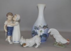 Three Royal Copenhagen porcelain figures and a vase tallest 21cm