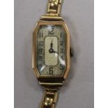 A lady's 1930's 9ct gold octagonal cased manual wind wrist watch, on a 9ct gold strap.