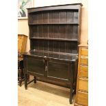 A 1920's ebonised oak dresser W.122cm